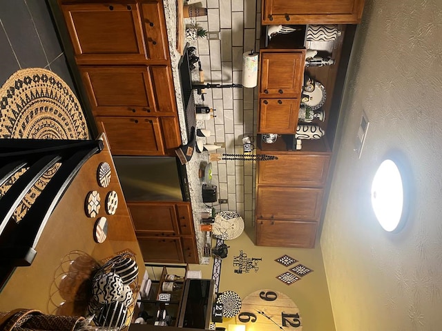 kitchen featuring brown cabinetry