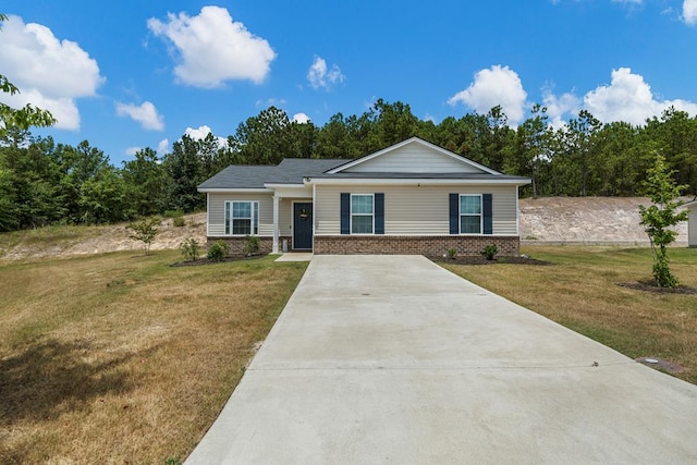 6368 Sandy Bottom Dr, Columbus, GA 31907 - view of front of house featuring concrete driveway, a front yard, and brick siding