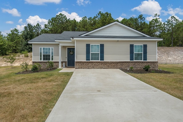 6368 Sandy Bottom Dr, Columbus, GA 31907 - view of front of house with brick siding, a front lawn, and concrete driveway