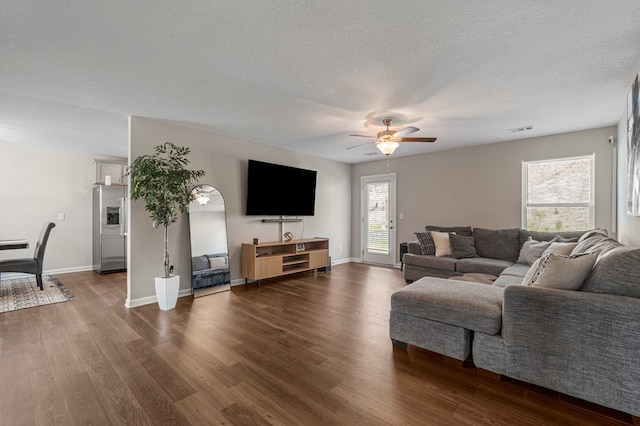 6368 Sandy Bottom Dr, Columbus, GA 31907 - living room featuring a ceiling fan, dark wood-type flooring, and a textured ceiling