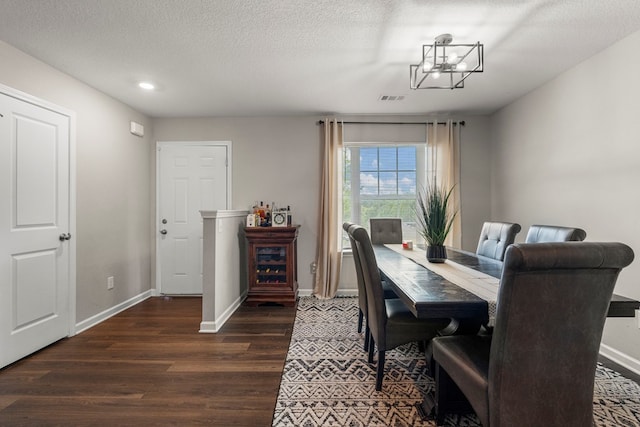 6368 Sandy Bottom Dr, Columbus, GA 31907 - dining room with dark wood-type flooring, a chandelier, a textured ceiling, and recessed lighting