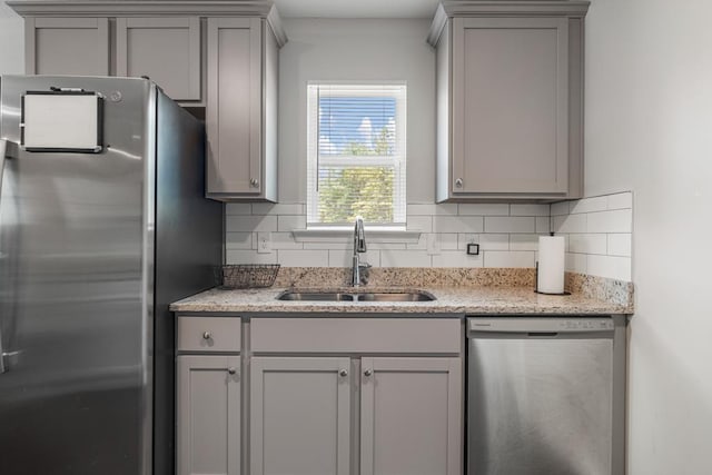 6368 Sandy Bottom Dr, Columbus, GA 31907 - kitchen with appliances with stainless steel finishes, gray cabinetry, backsplash, and light stone counters