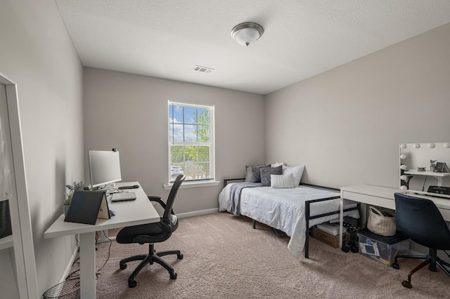 6368 Sandy Bottom Dr, Columbus, GA 31907 - carpeted bedroom featuring a desk and a textured ceiling