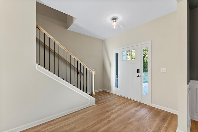 entryway with light hardwood / wood-style flooring