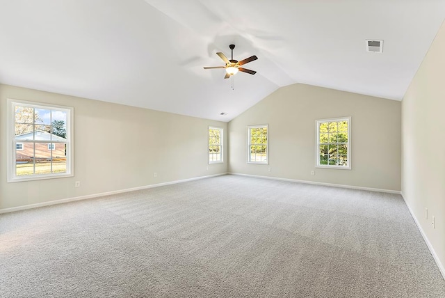 unfurnished room featuring ceiling fan, light carpet, and vaulted ceiling