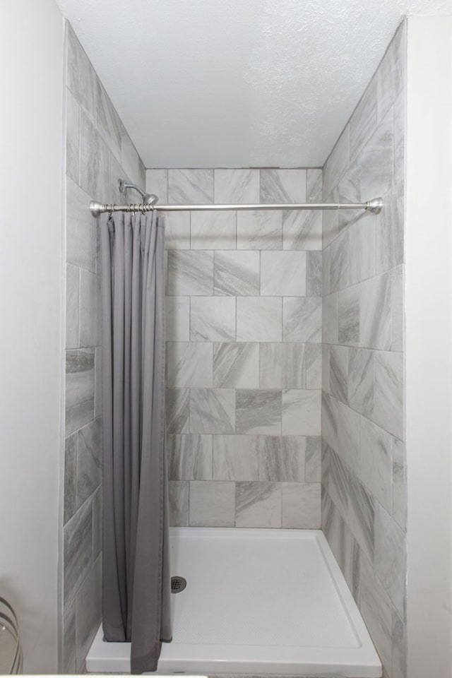 bathroom with a shower with shower curtain