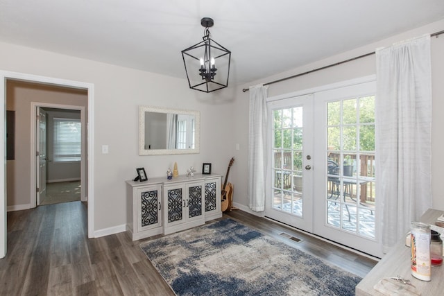 entryway featuring a chandelier, french doors, and dark hardwood / wood-style floors