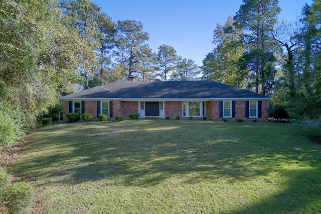 ranch-style house featuring a front lawn