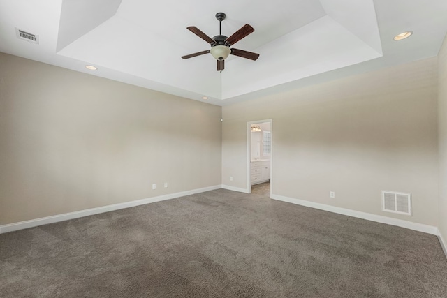 1032 Red Maple Way, Columbus, GA 31904 - spare room featuring a tray ceiling, ceiling fan, carpet floors, baseboards, and recessed lighting