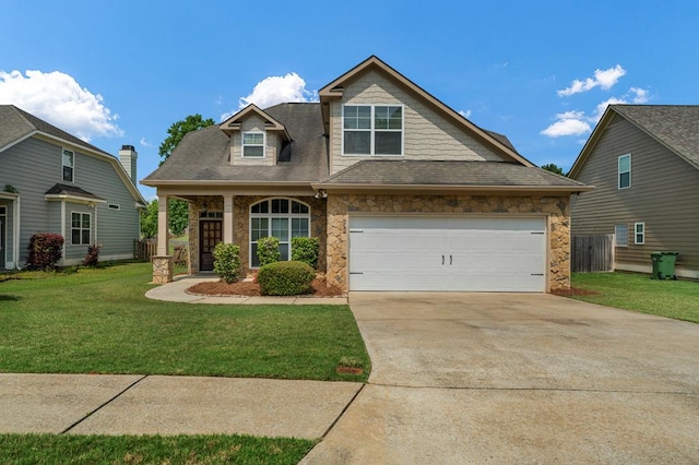 1032 Red Maple Way, Columbus, GA 31904 - view of front of house featuring stone siding, a front lawn, concrete driveway, and a shingled roof