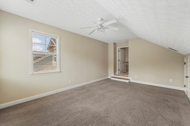1032 Red Maple Way, Columbus, GA 31904 - additional living space featuring lofted ceiling, carpet, a ceiling fan, baseboards, and a textured ceiling