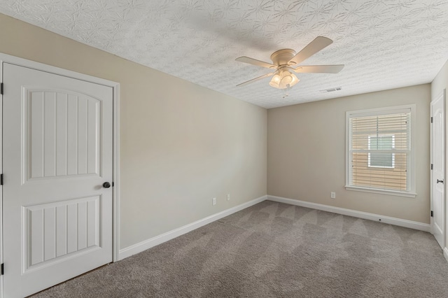 1032 Red Maple Way, Columbus, GA 31904 - carpeted spare room with ceiling fan, baseboards, and a textured ceiling