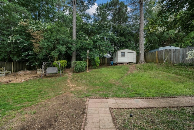 5936 Manassas Dr, Columbus, GA 31909 - fenced backyard with a storage unit and view of scattered trees