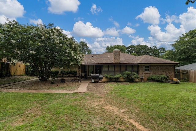 5936 Manassas Dr, Columbus, GA 31909 - rear view of house featuring a sunroom, a chimney, and brick siding
