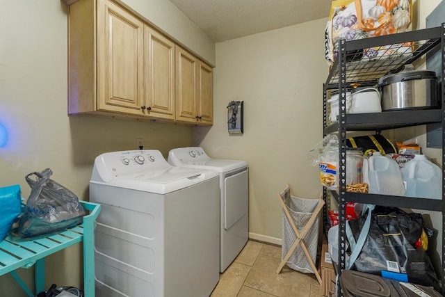 5936 Manassas Dr, Columbus, GA 31909 - washroom featuring independent washer and dryer, cabinet space, and light tile patterned floors