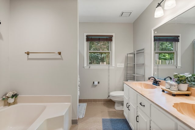 5936 Manassas Dr, Columbus, GA 31909 - bathroom featuring a bath, double vanity, and tile patterned floors