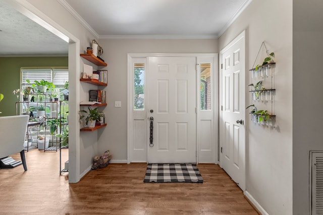 5936 Manassas Dr, Columbus, GA 31909 - entryway featuring plenty of natural light, wood finished floors, and crown molding