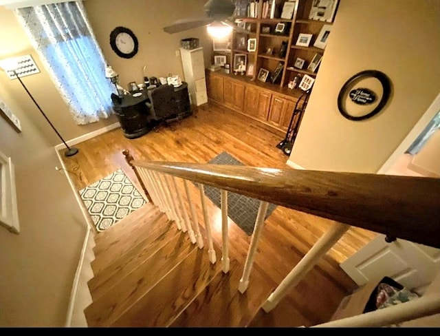 stairway with wood-type flooring