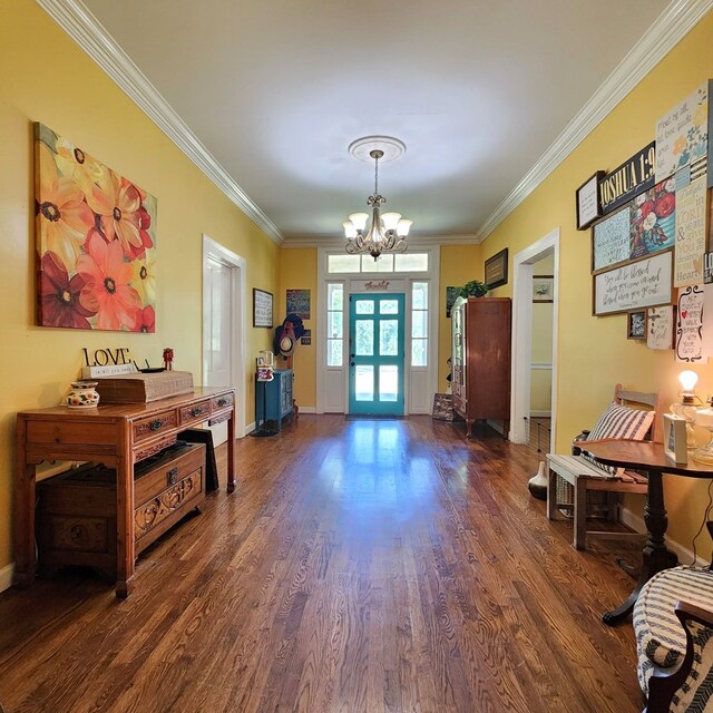 interior space featuring dark hardwood / wood-style floors, crown molding, and a notable chandelier