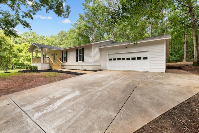 ranch-style home featuring a porch and a garage