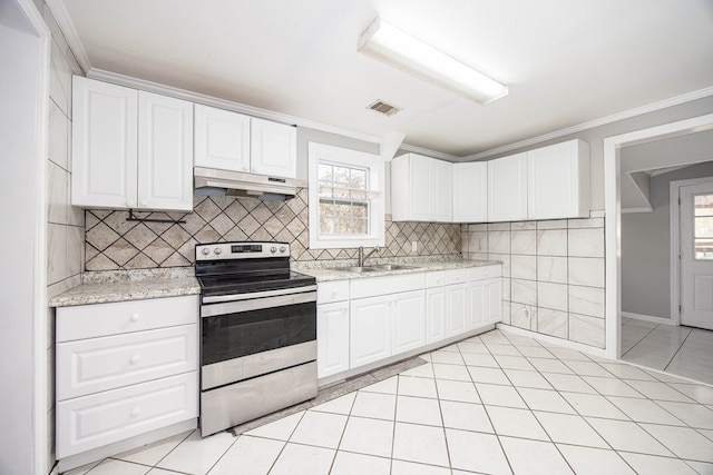 646 Byrd Ave, Smiths Station, AL 36877 - kitchen featuring light tile patterned floors, electric range, under cabinet range hood, visible vents, and a sink