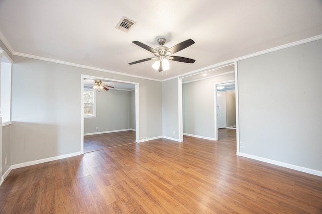 646 Byrd Ave, Smiths Station, AL 36877 - empty room featuring light wood finished floors, visible vents, baseboards, and ceiling fan