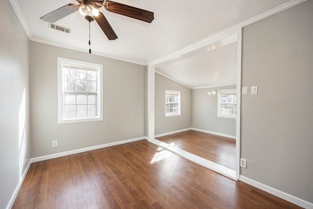 646 Byrd Ave, Smiths Station, AL 36877 - spare room with crown molding, visible vents, a ceiling fan, and wood finished floors