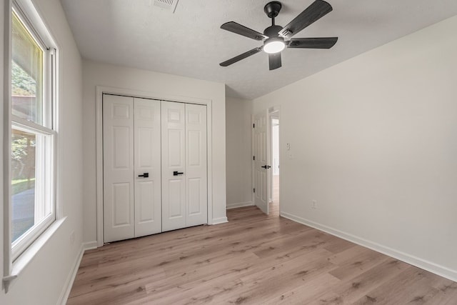 766 Lee Road 0553, Phenix City, AL 36870 - unfurnished bedroom with light wood-style flooring, a closet, and ceiling fan