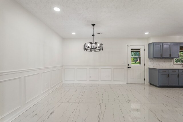 766 Lee Road 0553, Phenix City, AL 36870 - unfurnished dining area with a decorative wall, a chandelier, recessed lighting, wainscoting, and light marble finish floors