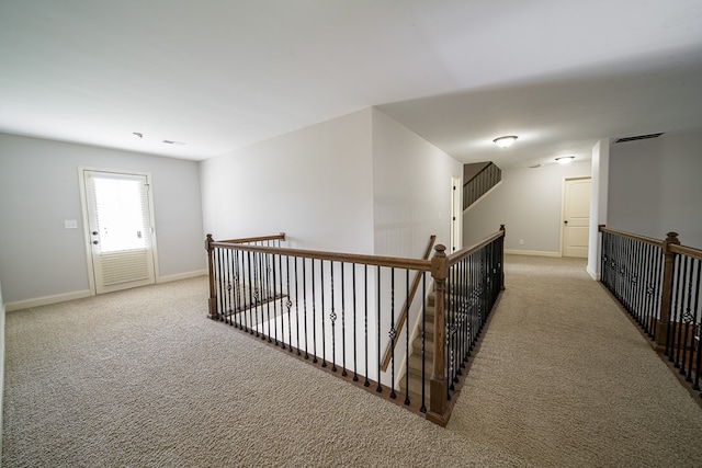 hallway with light carpet