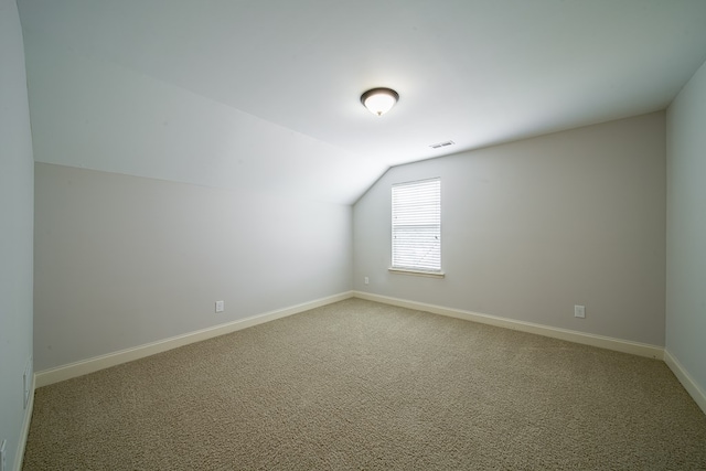 bonus room featuring carpet and lofted ceiling