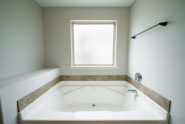 bathroom with a tub