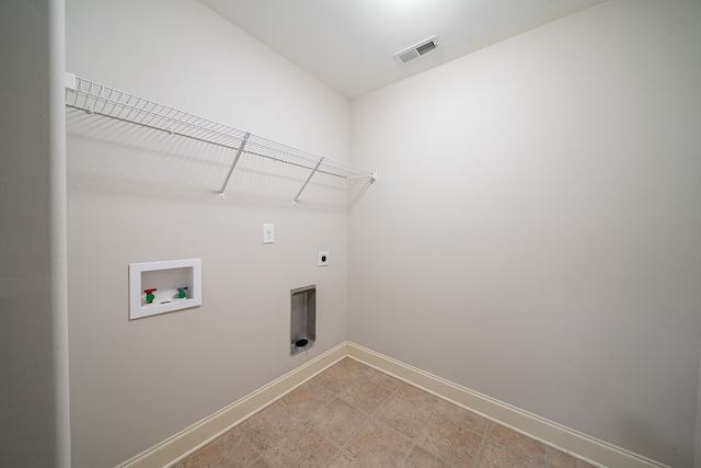 clothes washing area featuring hookup for an electric dryer and washer hookup