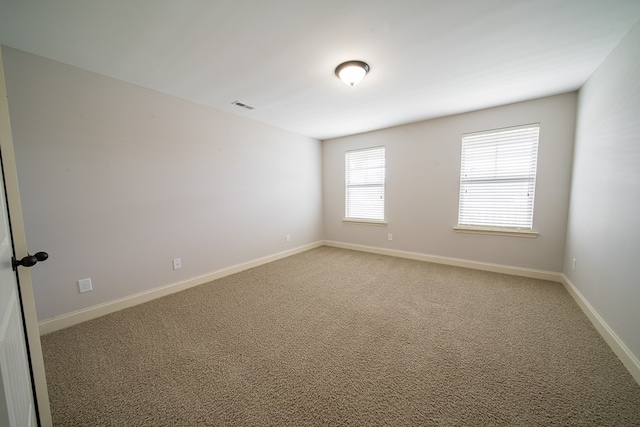 view of carpeted spare room