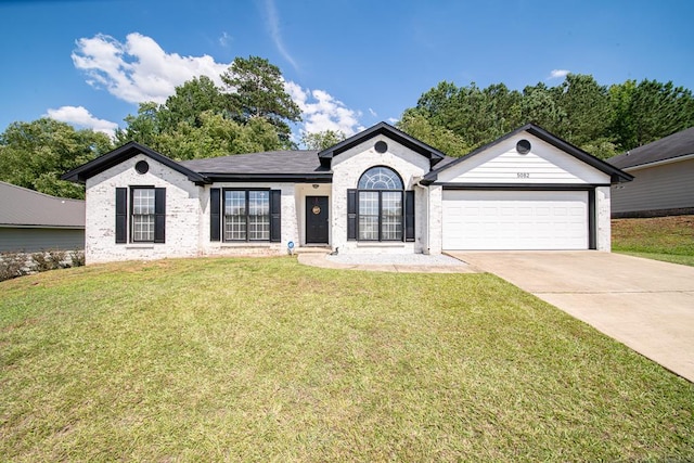 5082 Aaron Ln, Columbus, GA 31907 - single story home featuring an attached garage, driveway, a front lawn, and brick siding