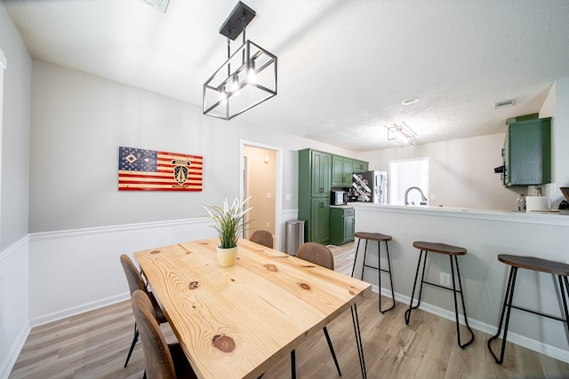 5082 Aaron Ln, Columbus, GA 31907 - dining room with light wood-style floors and baseboards