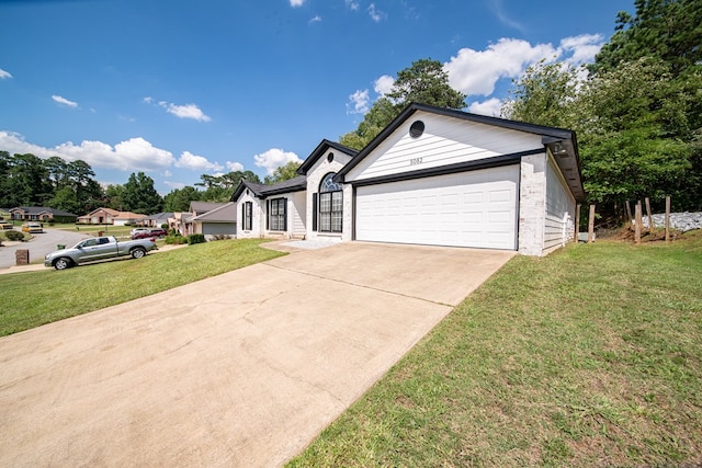 5082 Aaron Ln, Columbus, GA 31907 - ranch-style house with a front lawn, driveway, and an attached garage