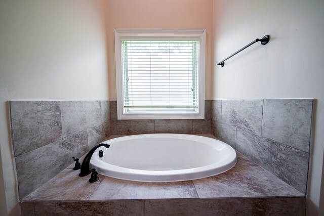 235 Pebblebrook Ln, Columbus, GA 31904 - bathroom with a bath and healthy amount of natural light