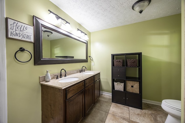 170 Slappy Dr, Hamilton, GA 31811 - bathroom featuring a textured ceiling and double vanity