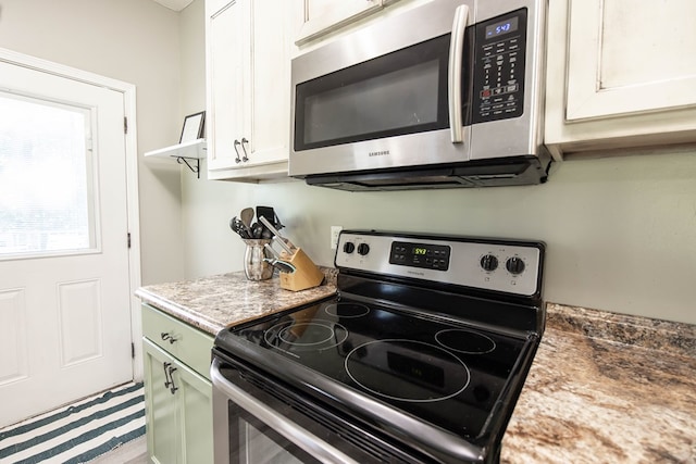 170 Slappy Dr, Hamilton, GA 31811 - kitchen featuring appliances with stainless steel finishes, white cabinets, and light countertops