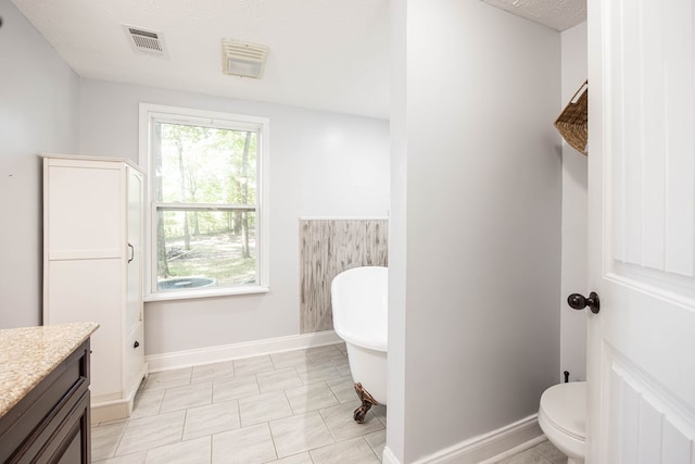170 Slappy Dr, Hamilton, GA 31811 - full bath with a freestanding tub, vanity, and a textured ceiling