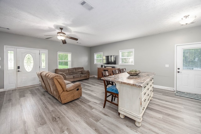 170 Slappy Dr, Hamilton, GA 31811 - living area featuring light wood-style flooring, a textured ceiling, and ceiling fan
