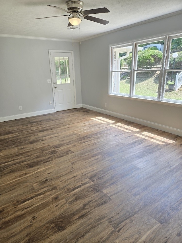4044 Castlewood Pkwy, Columbus, GA 31907 - spare room with ornamental molding, dark wood-style flooring, a ceiling fan, and baseboards