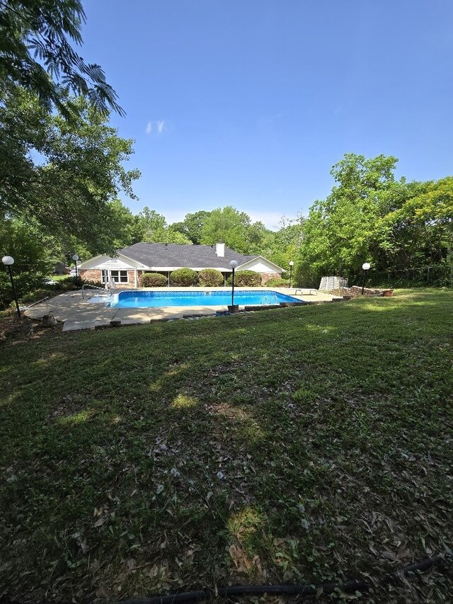 4044 Castlewood Pkwy, Columbus, GA 31907 - outdoor pool with a lawn and a patio area