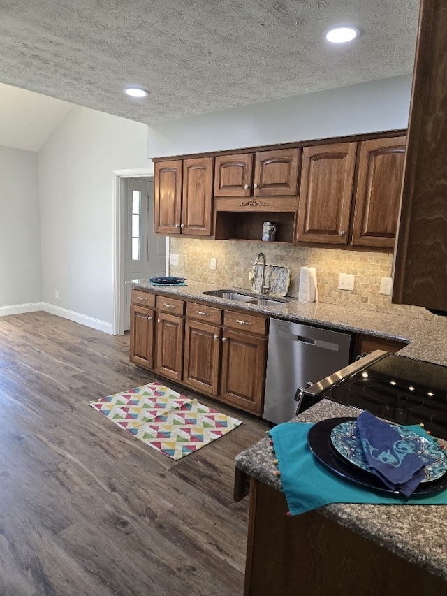 4044 Castlewood Pkwy, Columbus, GA 31907 - kitchen with dishwasher, a sink, tasteful backsplash, a textured ceiling, and baseboards