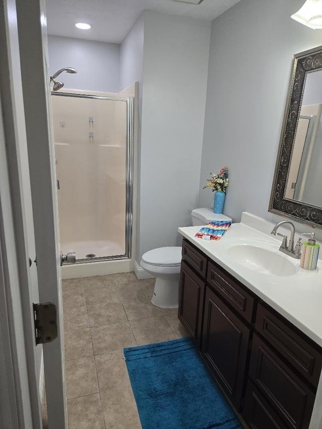 4044 Castlewood Pkwy, Columbus, GA 31907 - bathroom with a stall shower, vanity, toilet, and tile patterned floors