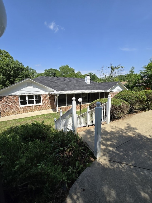 4044 Castlewood Pkwy, Columbus, GA 31907 - view of front of property with a chimney, brick siding, and fence