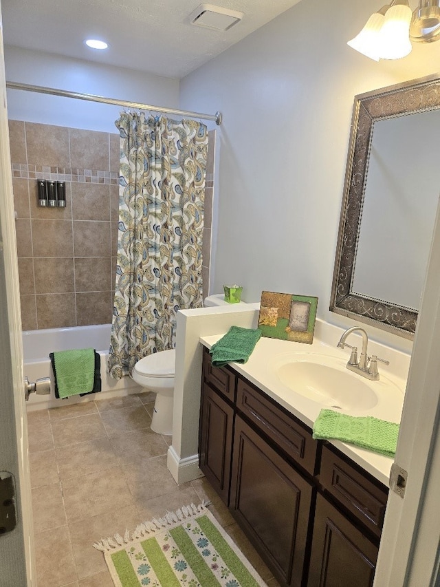 4044 Castlewood Pkwy, Columbus, GA 31907 - full bathroom with toilet, vanity, shower / bath combo with shower curtain, and tile patterned flooring