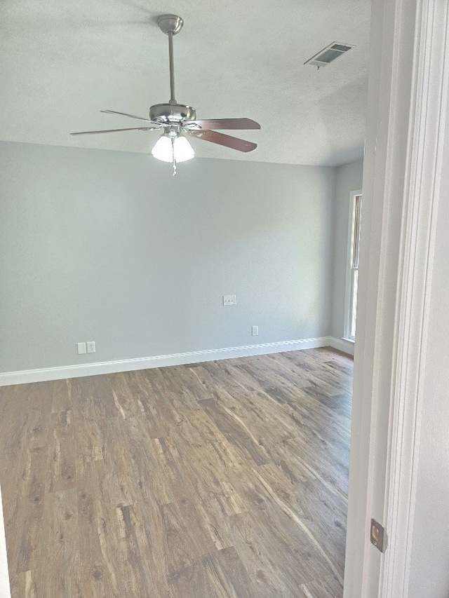 4044 Castlewood Pkwy, Columbus, GA 31907 - unfurnished room with ceiling fan, wood finished floors, baseboards, and a textured ceiling