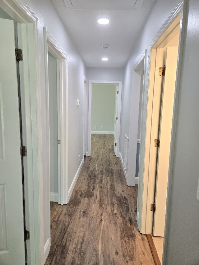 4044 Castlewood Pkwy, Columbus, GA 31907 - hallway featuring wood finished floors, baseboards, and attic access